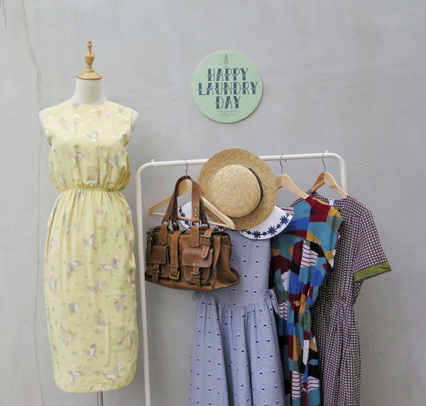 Hanamee | Vintage 1950s 1960s pastel yellow silky Dress with button back and butterfly print