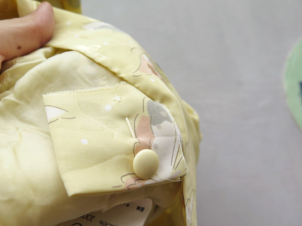 Hanamee | Vintage 1950s 1960s pastel yellow silky Dress with button back and butterfly print