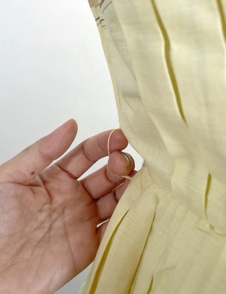 Vintage 1950s mid-century pleated sleeveless dress in lemon yellow | Brûlée | { Rare Find }