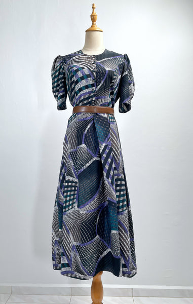 Noelle | Vintage 1970s geometric swirl print dress with matching fabric buttons