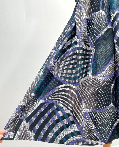 Noelle | Vintage 1970s geometric swirl print dress with matching fabric buttons