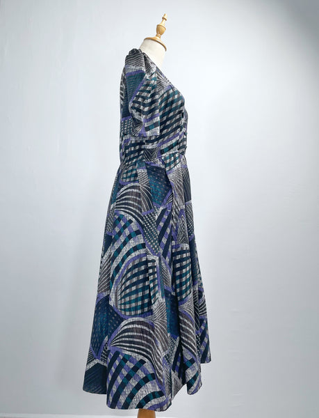 Noelle | Vintage 1970s geometric swirl print dress with matching fabric buttons