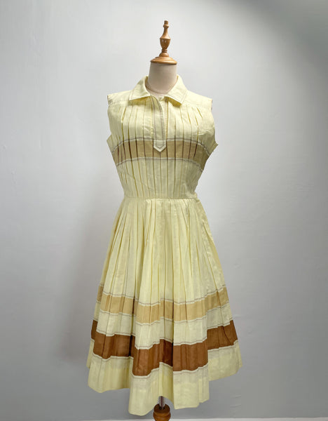 Vintage 1950s mid-century pleated sleeveless dress in lemon yellow | Brûlée | { Rare Find }