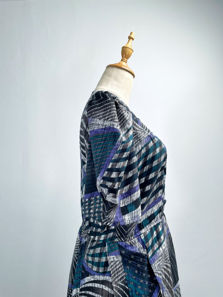 Noelle | Vintage 1970s geometric swirl print dress with matching fabric buttons