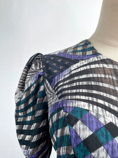 Noelle | Vintage 1970s geometric swirl print dress with matching fabric buttons