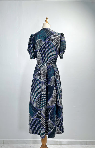 Noelle | Vintage 1970s geometric swirl print dress with matching fabric buttons