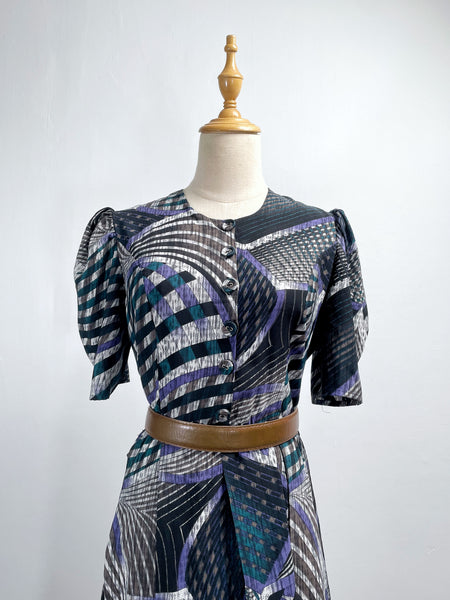 Noelle | Vintage 1970s geometric swirl print dress with matching fabric buttons