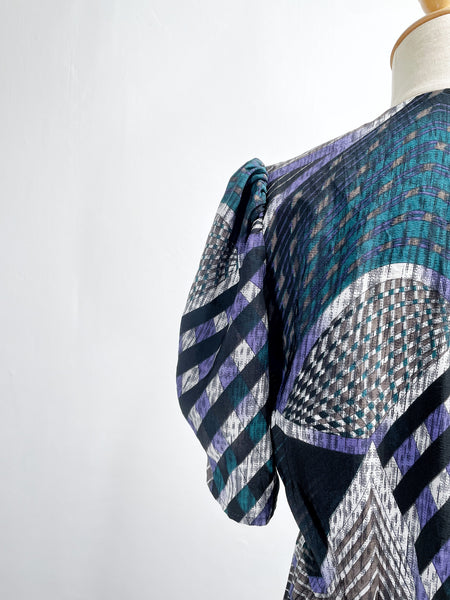 Noelle | Vintage 1970s geometric swirl print dress with matching fabric buttons