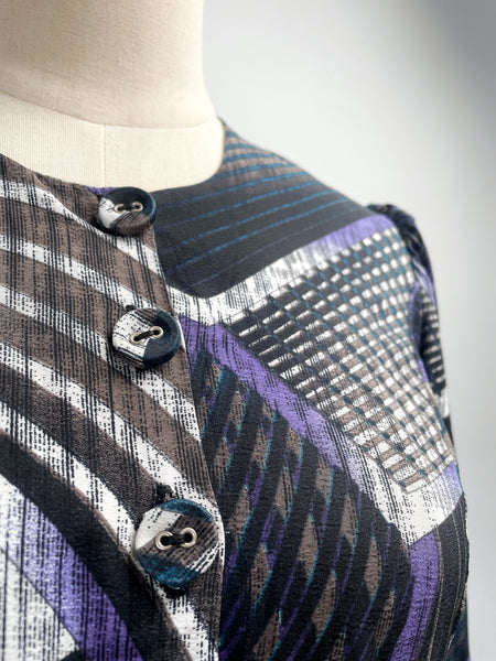 Noelle | Vintage 1970s geometric swirl print dress with matching fabric buttons