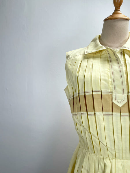 Vintage 1950s mid-century pleated sleeveless dress in lemon yellow | Brûlée | { Rare Find }