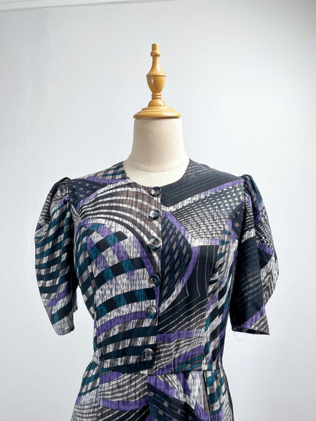 Noelle | Vintage 1970s geometric swirl print dress with matching fabric buttons
