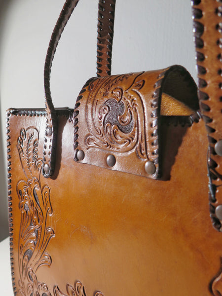 Vintage 60s 70s honey-tan leather tooled tote with Ornate carvings and turnlock closure bohemian hippie style