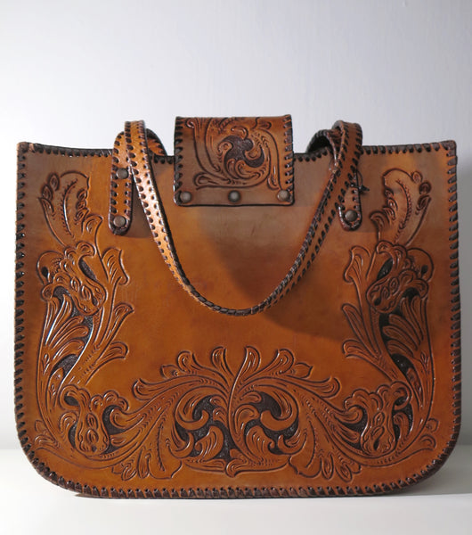 Vintage 60s 70s honey-tan leather tooled tote with Ornate carvings and turnlock closure bohemian hippie style