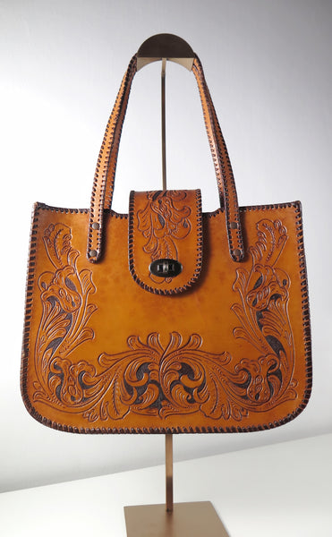 Vintage 60s 70s honey-tan leather tooled tote with Ornate carvings and turnlock closure bohemian hippie style