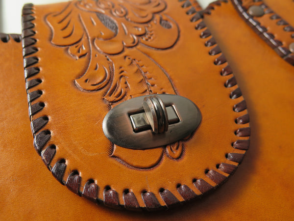 Vintage 60s 70s honey-tan leather tooled tote with Ornate carvings and turnlock closure bohemian hippie style