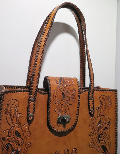 Vintage 60s 70s honey-tan leather tooled tote with Ornate carvings and turnlock closure bohemian hippie style