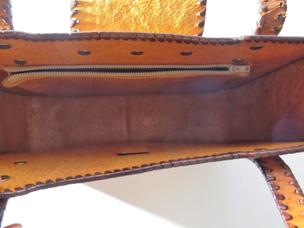 Vintage 60s 70s honey-tan leather tooled tote with Ornate carvings and turnlock closure bohemian hippie style