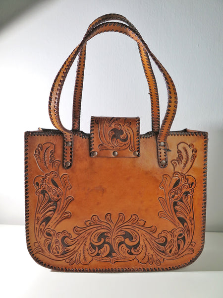 Vintage 60s 70s honey-tan leather tooled tote with Ornate carvings and turnlock closure bohemian hippie style