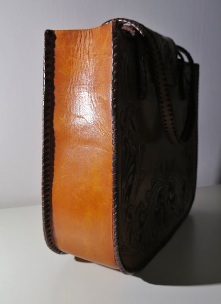 Vintage 60s 70s honey-tan leather tooled tote with Ornate carvings and turnlock closure bohemian hippie style
