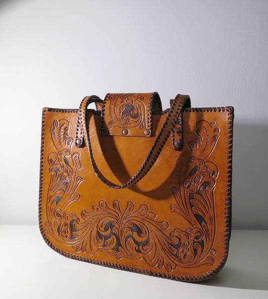 Vintage 60s 70s honey-tan leather tooled tote with Ornate carvings and turnlock closure bohemian hippie style