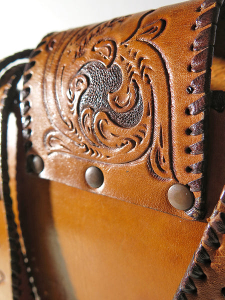 Vintage 60s 70s honey-tan leather tooled tote with Ornate carvings and turnlock closure bohemian hippie style