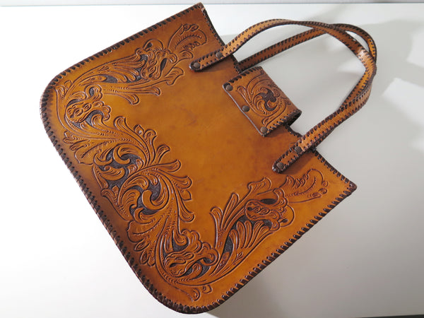 Vintage 60s 70s honey-tan leather tooled tote with Ornate carvings and turnlock closure bohemian hippie style