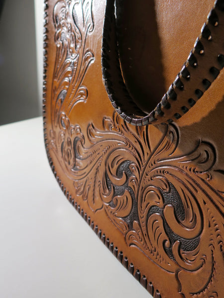 Vintage 60s 70s honey-tan leather tooled tote with Ornate carvings and turnlock closure bohemian hippie style