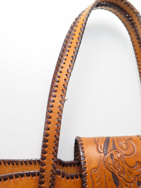 Vintage 60s 70s honey-tan leather tooled tote with Ornate carvings and turnlock closure bohemian hippie style