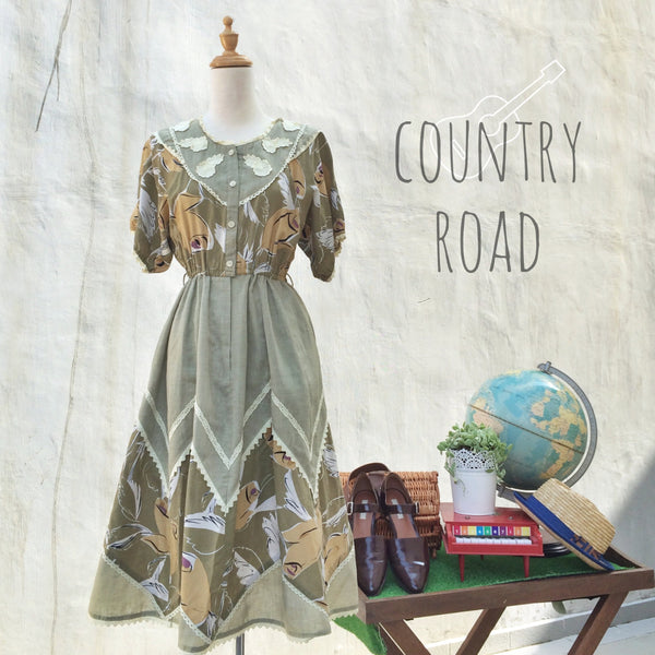 Country Road | Vintage 1980s zig-zag triangle abstract print dress with lace hem and floral flowers