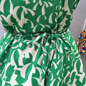 Green Curves | Vintage 1970s 1980s Grass green dress with pale cream crescent strips | Confetti Party Anyone?