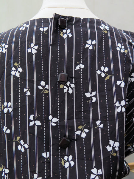 Blake | Vintage 1980s buttoned-back black dress with floral print polka dots Midi dress