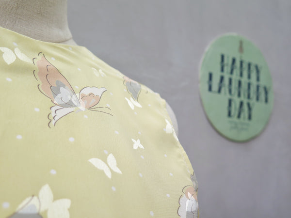 Hanamee | Vintage 1950s 1960s pastel yellow silky Dress with button back and butterfly print